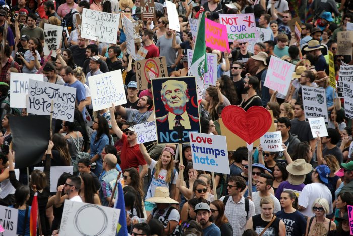 Protesters across us global rally against trump musk